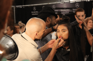 The Art of Application: Makeup Brushes Roque Cozzette doing makeup on a model at The Reem Acra fashion show