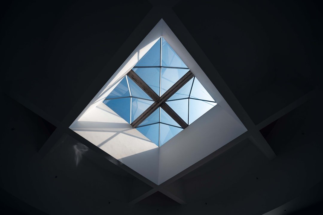 Geometric skylight with bright blue sky visible architecture structure